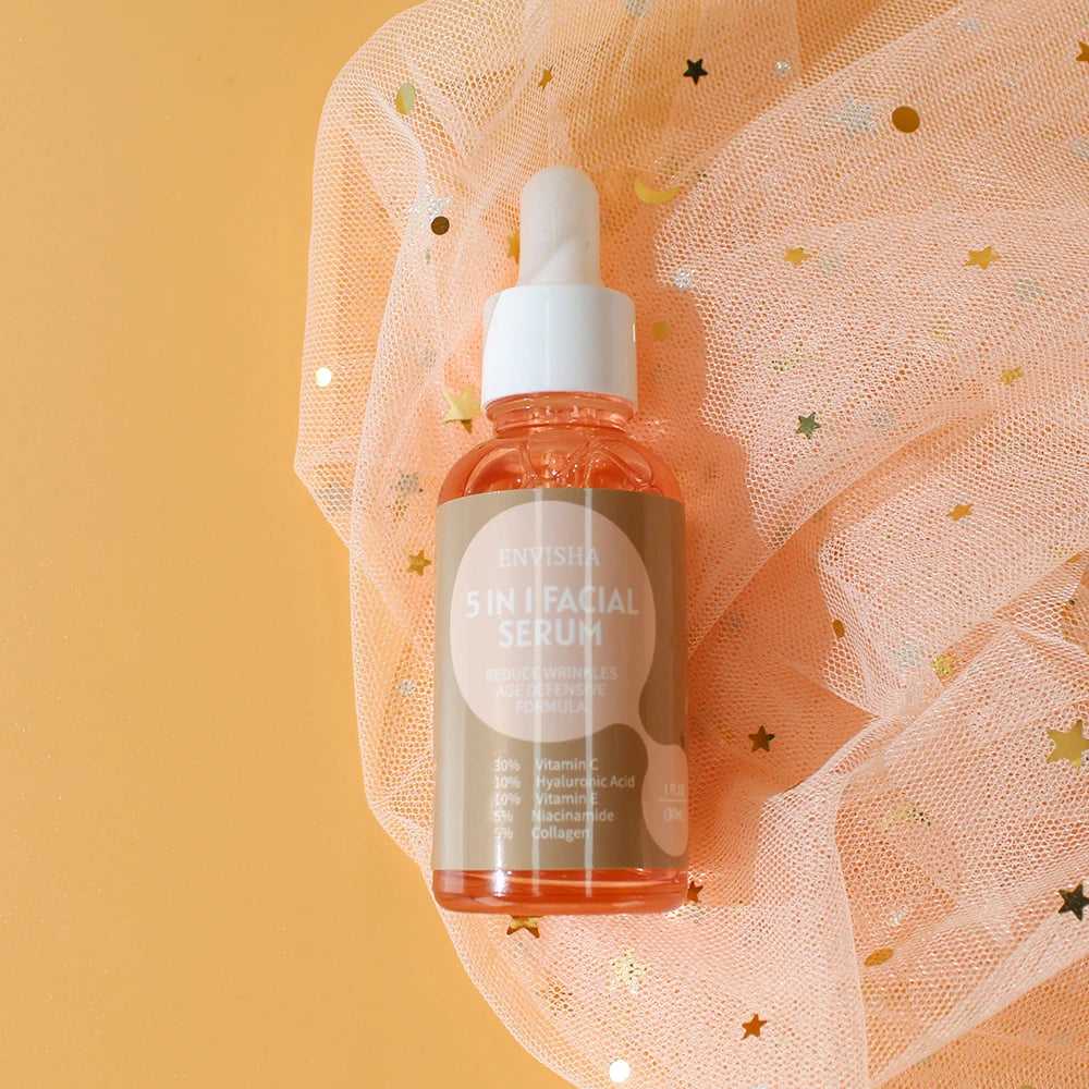 ENVISHA 5 in 1 Facial Serum in a glass dropper bottle for glowing and hydrated skin