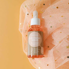 ENVISHA 5 in 1 Facial Serum in a glass dropper bottle for glowing and hydrated skin