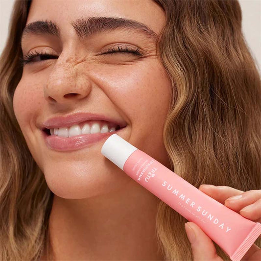 LANBENA Summer Lip Balm for Smooth Lips in a Pink Tube with a Model Smiling Radiantly