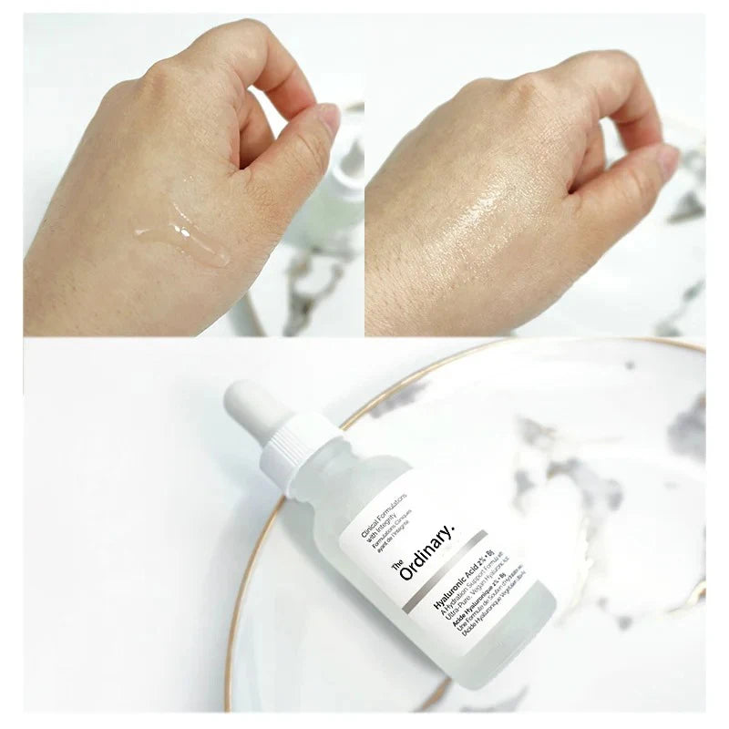 LANBENA hydrating hyaluronic acid serum applied on skin with a glass dropper bottle on a plate