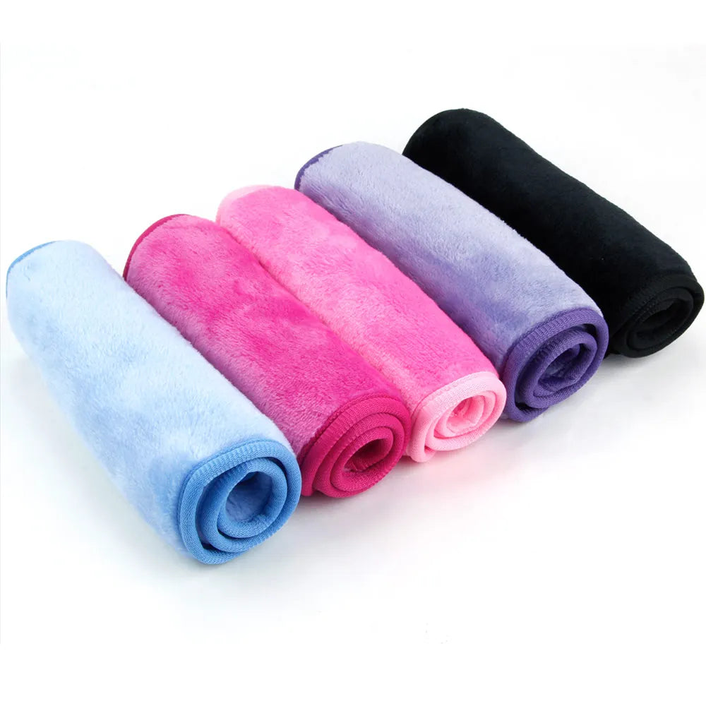 Set of five soft cleansing microfiber towels in blue, pink, purple, and black for makeup removal