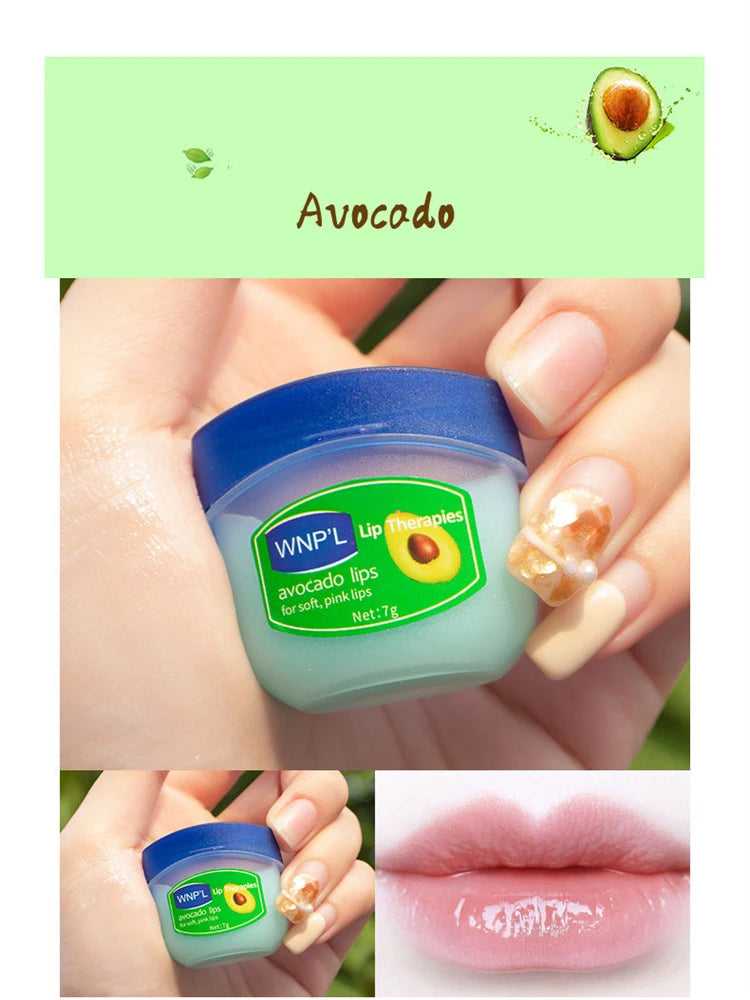 WNPL Avocado Lip Therapy for soft, pink lips in a small blue container held by a person