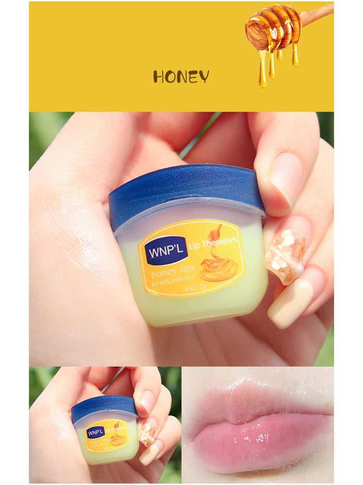 WNP'L Honey Lip Therapy Balm in a clear container with a blue lid for hydrated, soft lips